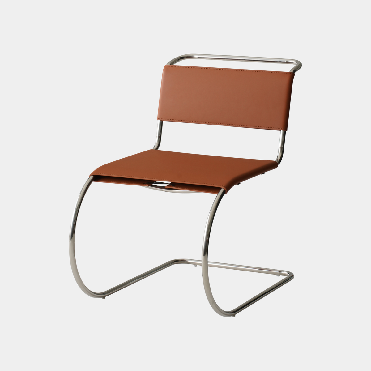 A modern cantilever chair with a warm brown leather seat and backrest, supported by a curved polished chrome steel frame, shown against a plain light gray background.