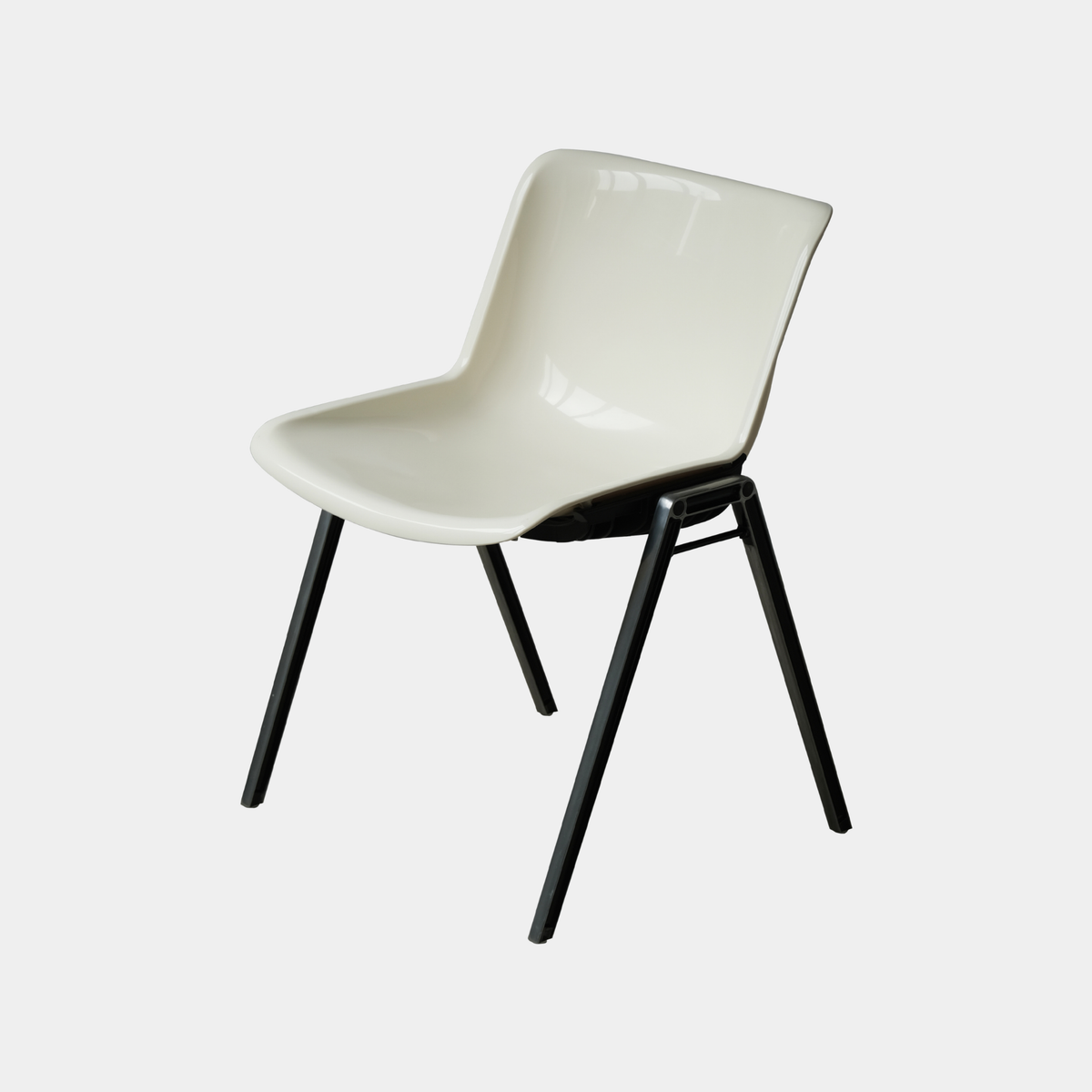 A modern molded plastic dining chair with a glossy off-white seat and backrest, supported by four tapered black metal legs, shown against a light gray background.