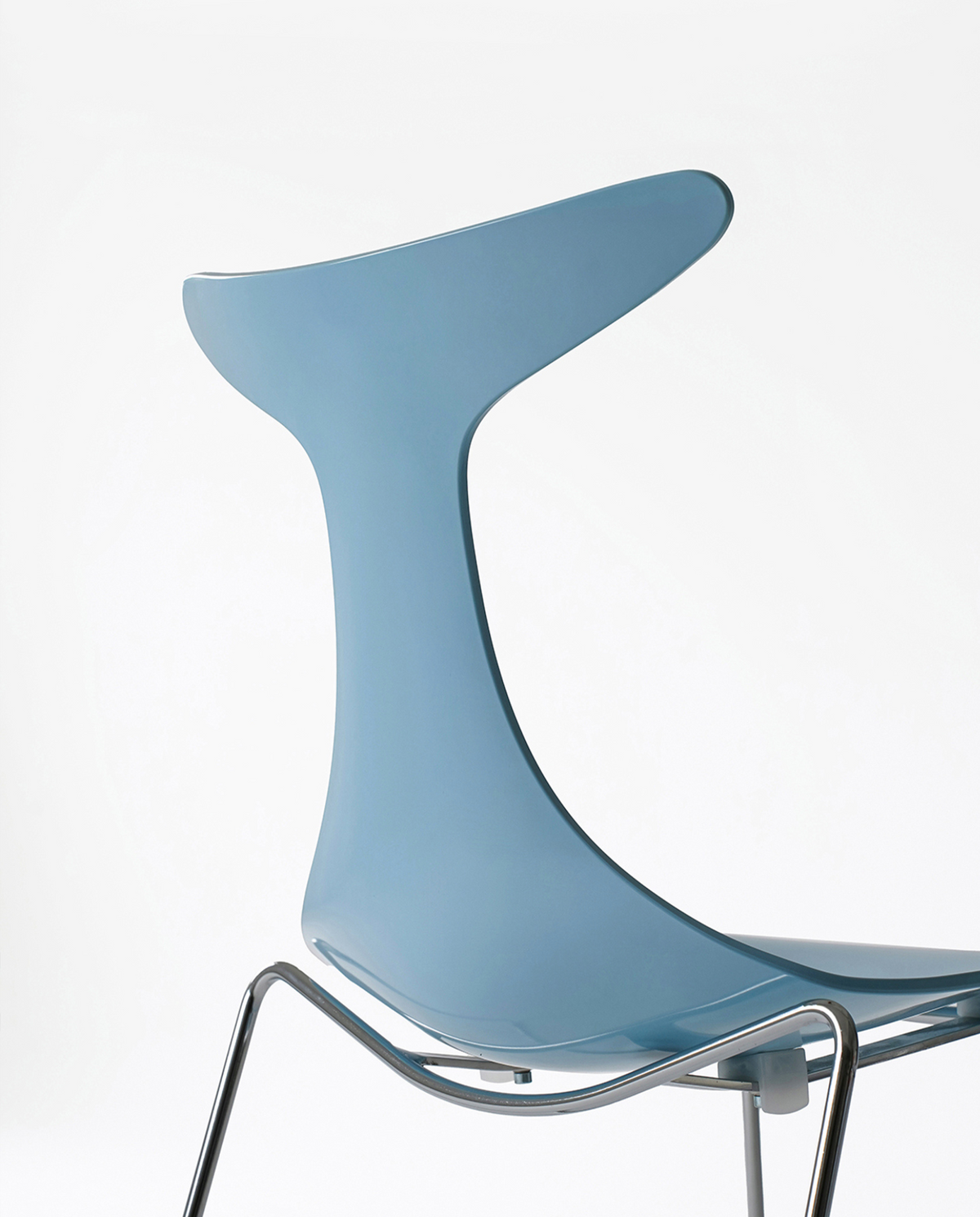 A light blue molded plastic chair back and seat with a chrome metal leg frame, shown against a plain white background.