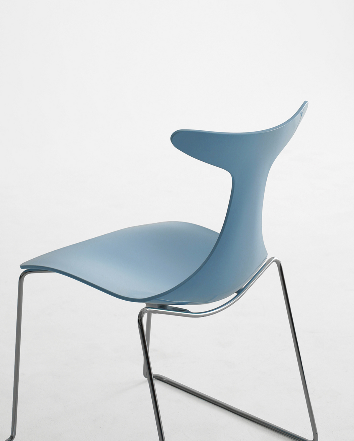 A modern side chair with a light blue molded plastic shell and a thin metal wire frame, shown against a plain white studio background.