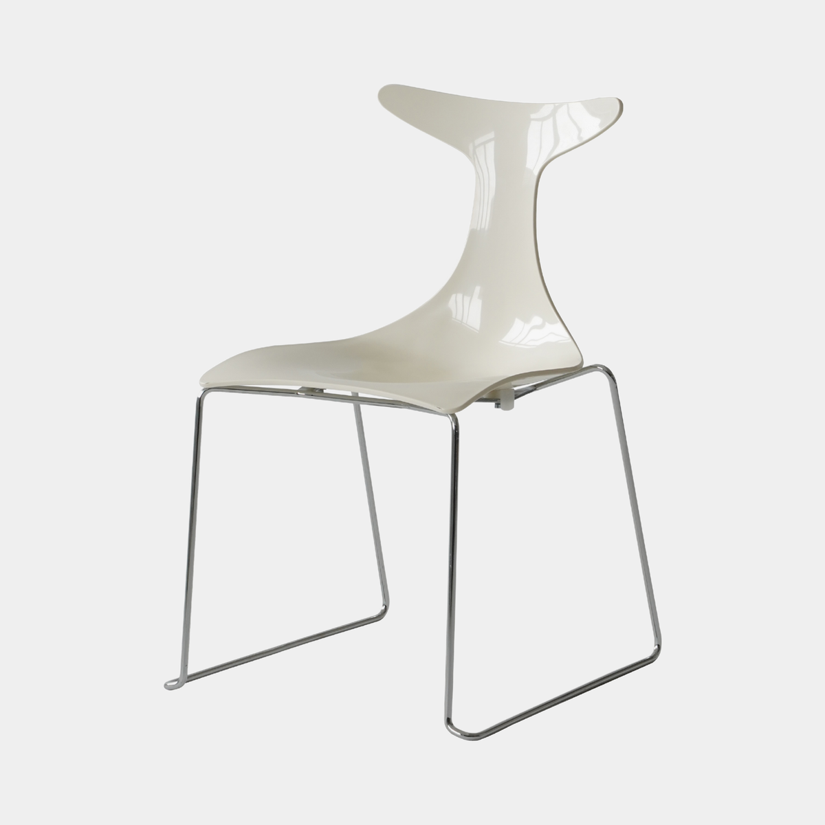 A modern side chair with a glossy off-white molded plastic seat and backrest, supported by a chrome metal cantilever frame, shown against a light gray background.