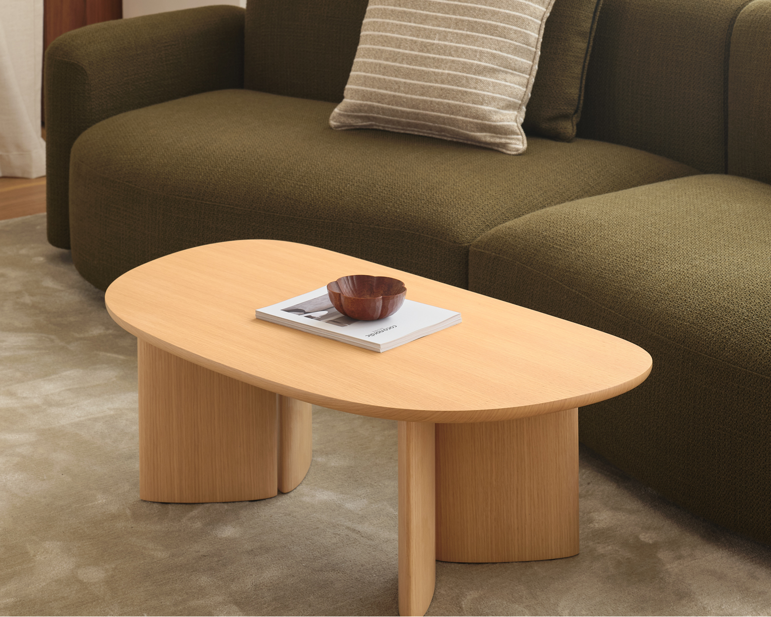 Oak wooden coffee table featured with a custom designer furniture sofa