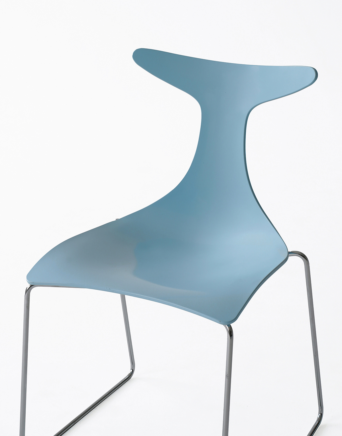 A modern molded plastic chair with a light blue seat and backrest, supported by a thin chrome metal frame, shown against a plain white background.