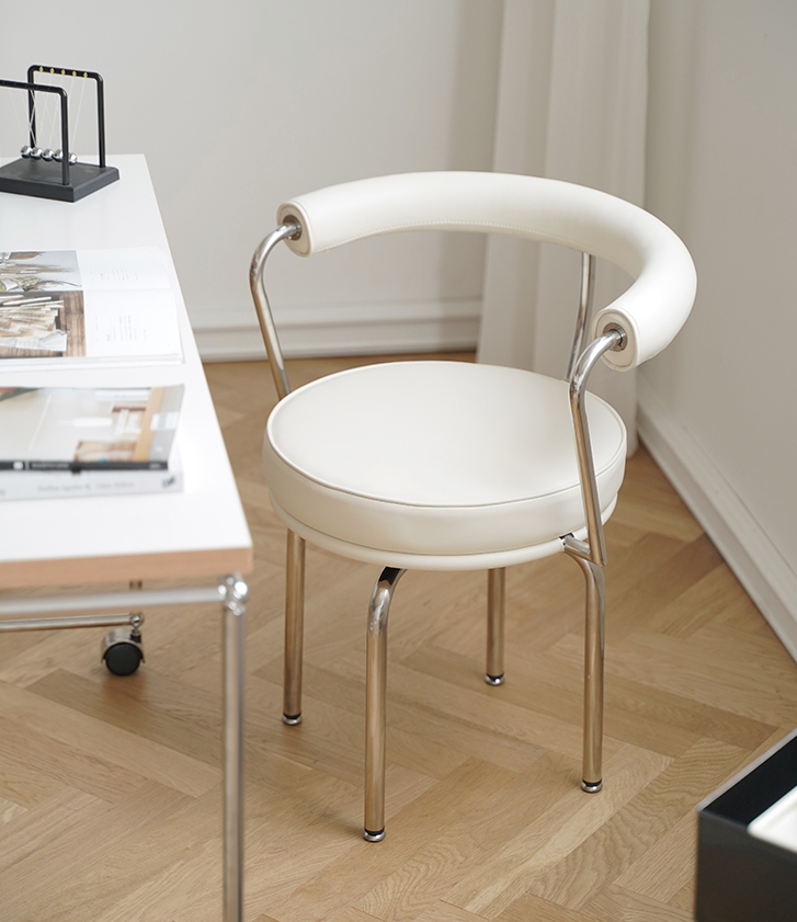 LC7 Swivel Chair | Charlotte Perriand Replica - The Feelter